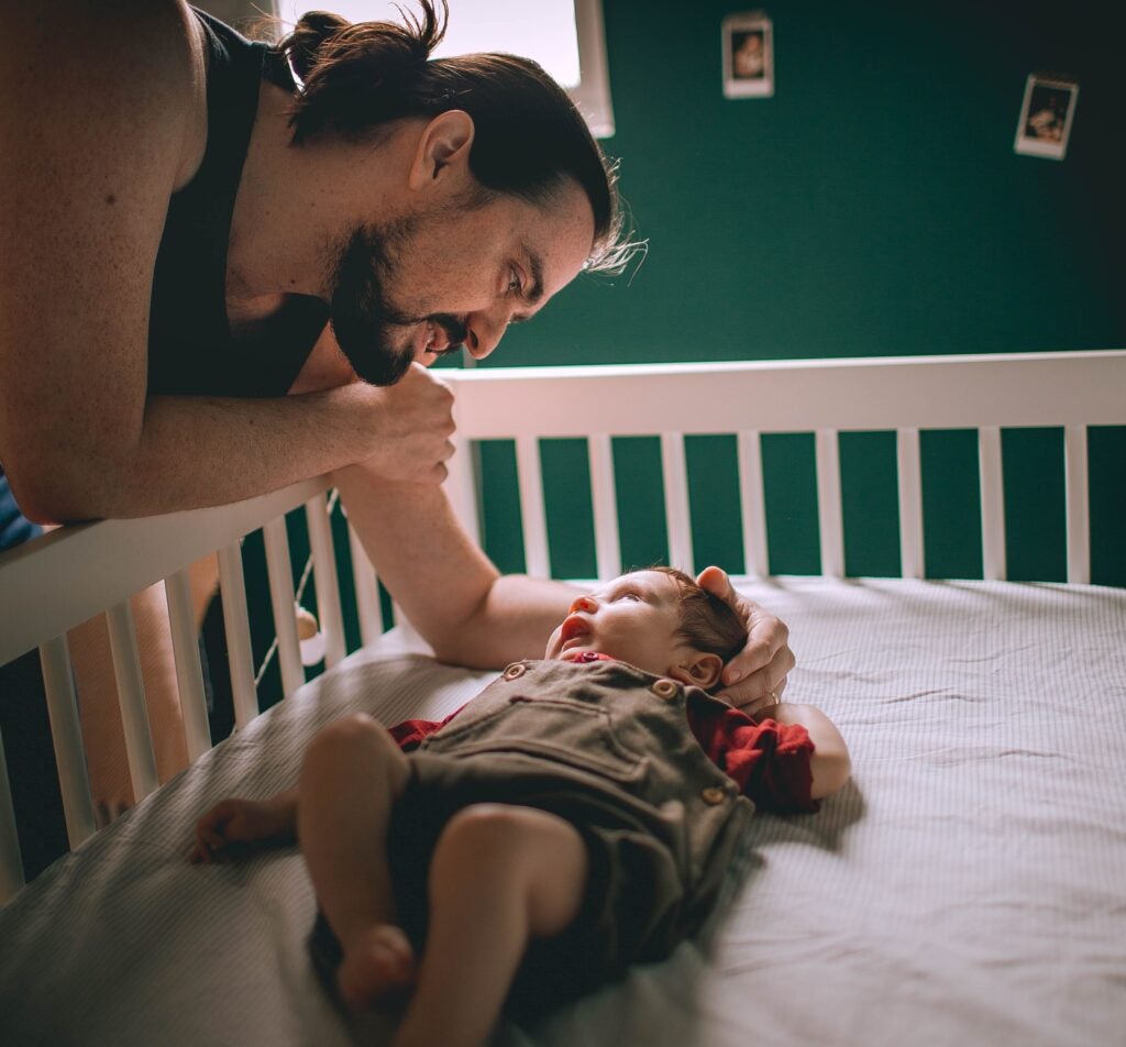 Dad Putting Toddler To Sleep